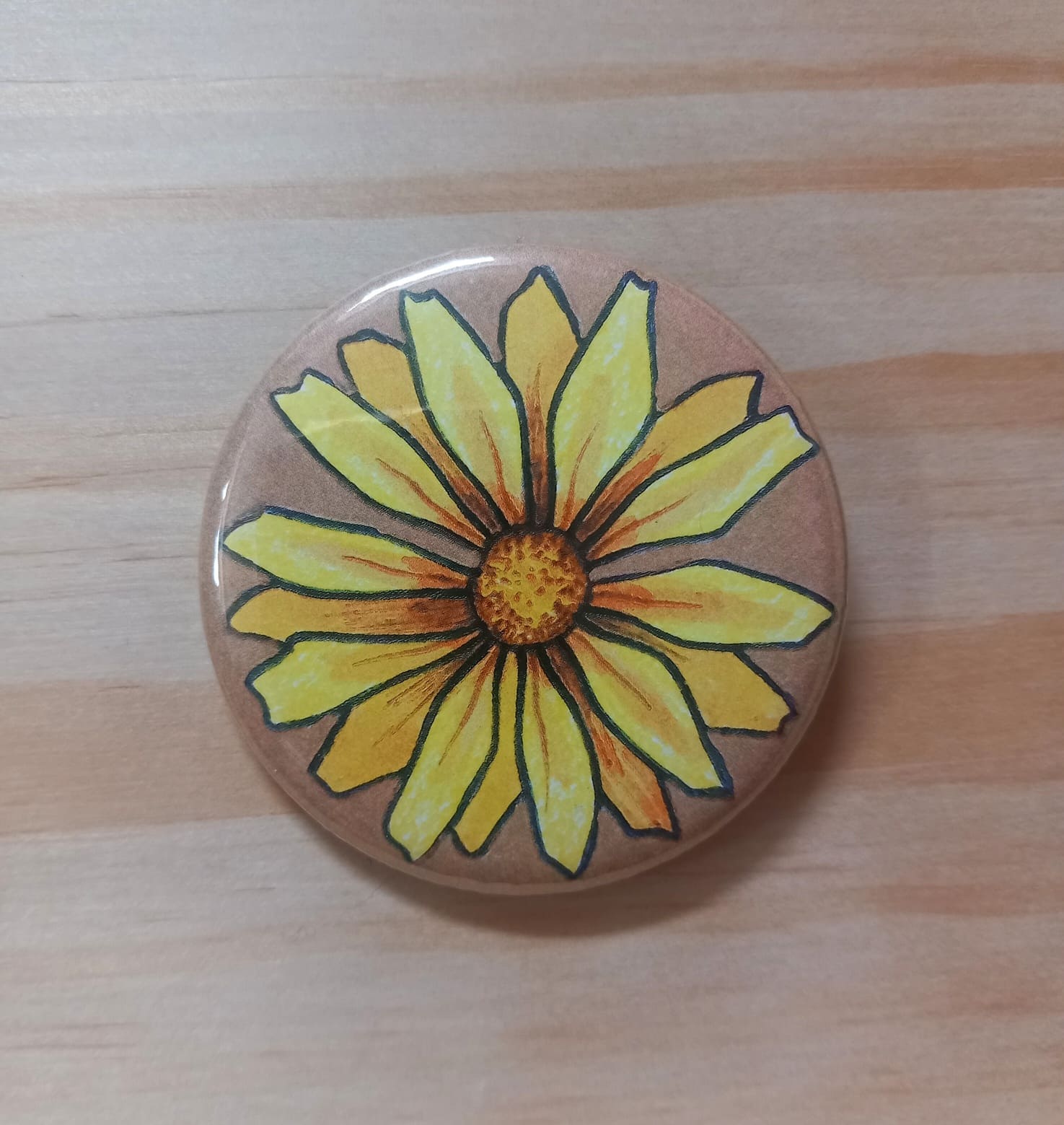 Badge marguerite jaune